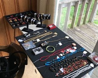 Assorted costume jewelry, ear rings and men’s and women’s watches