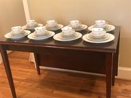 Rosenthal China from Germany marked "Hillside" pattern. Drop leaf table with glass top.
