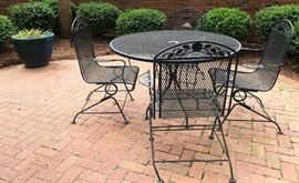 Wrought iron umbrella table w/4 chairs, large blue planter.