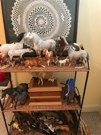Framed vintage doiley, small shelf, Grand Champion and Breyers horse collectibles.