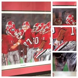 UGA signed, numbered, and autographed print "The Huddle" by K. Modak (signed). Autographs from Hinds Ward #19 , Matt Stitchcomb #79 , and Mike Bo Bo #14