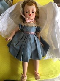 Antique doll, hard plastic, blue sleep eyes, complete with shoes, blue taffeta dress, bonnet and bloomers. Human h air