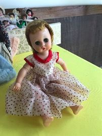Antique jointed plastic doll with sleep eyes and human hair