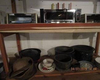 Another shelves FULL of cast iron items, enamel pans, etc.....