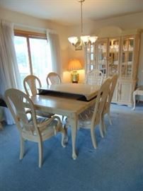 Like new  Dining Room set.  upholstered seats still have the protective plastic on them.