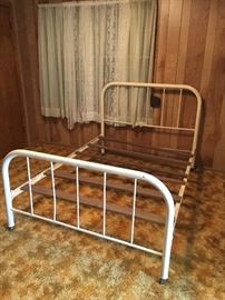 Antique full/double metal bed with rails and slats.