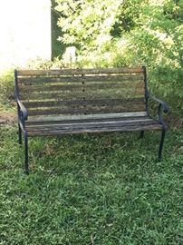 Slatted wood outdoor park bench.