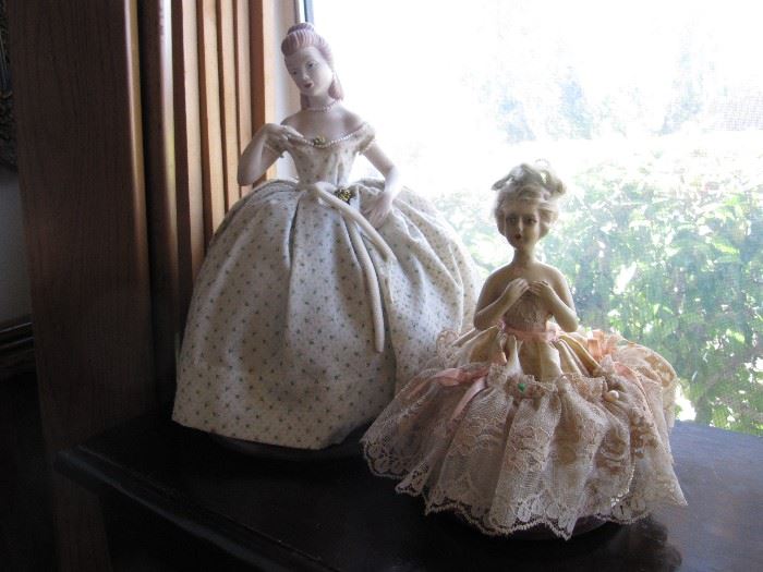 Antique figurines including pin cushion