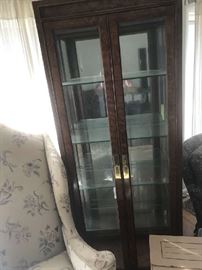 Henredon Curio cabinet one of pair, glass shelves, lighted from top down through cabinet
