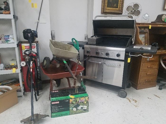 Outdoor items - Kenmore gas grill, weedeater, wheelbarrow, Sears Walking Tractor sprinkler in original box 