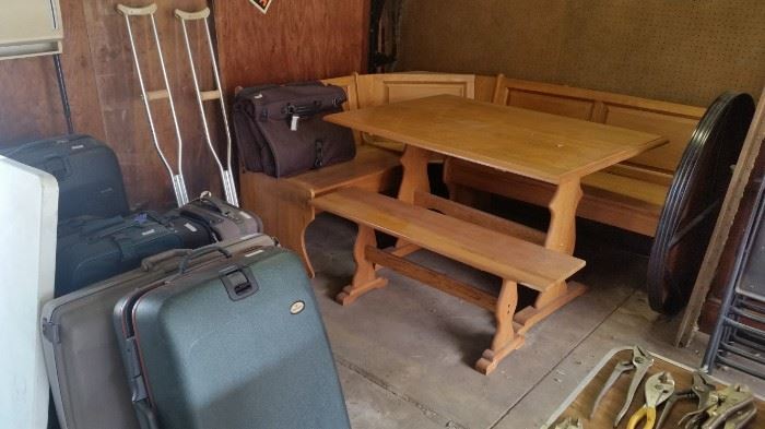 Vintage oak kitchen bankette.  Luggage.