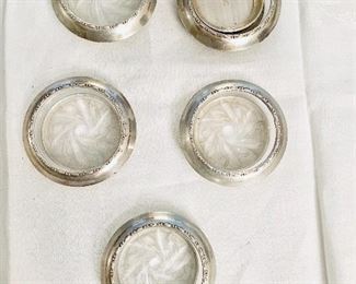 Cut glass coasters with silver rim