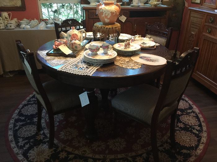 In the Dining Room is a beautiful table with one leaf and two more hand made leaves, four chair and wonderful Limoges china