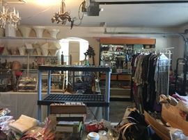 The garage is full, lots of lamp shades, vintage clothing, doll furniture, frames, vintage clothing and lots more