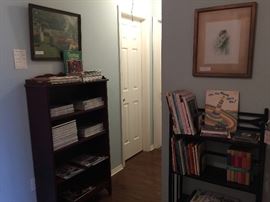 Upstairs in the hallway you will find more books, magazines and art work