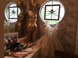 Vintage mannequin, vintage wedding dress and linens