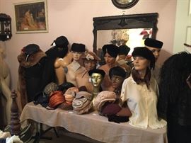 The vintage mannequins with vintage hats, wonderful mirror and art