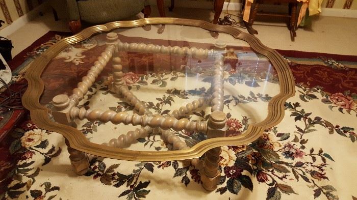 Glass top coffee table with wooden base