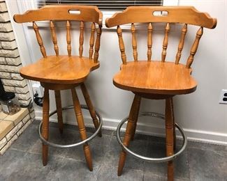4 matching vintage hard rock maple swivel bar stools.