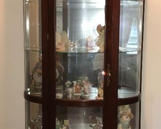 Curved glass lighted curio/display cabinet.