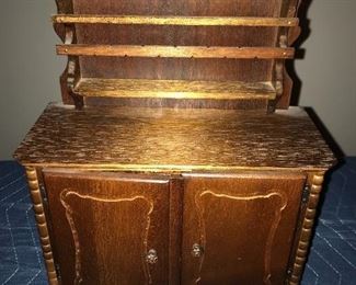 Doll-size china hutch.