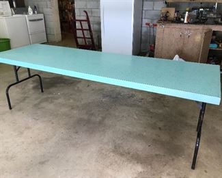 Nice long vintage folding table with pretty turquoise Formica top.