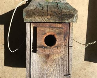 Tools and garage items, including this rustic wood bird house.