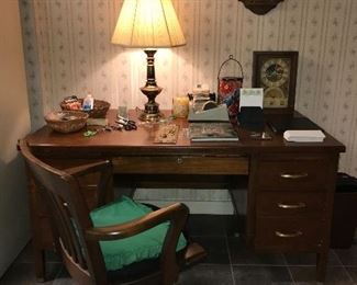 Solid wood desk and chair, office supplies.