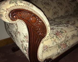 Lovely vintage sofa with carved wood trim. Center back fruit motif is repeated on each side of the sofa.