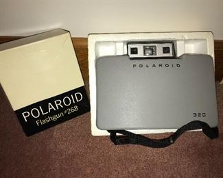 Vintage Polaroid camera and flashgun.