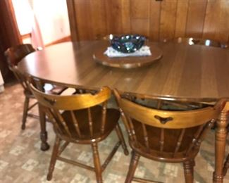Vintage hard rock maple dining table with removable lazy Susan and 6 chairs.