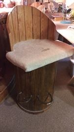 Amazing bar stools made from electrical wire spools, with horseshoe footrests