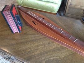 Antique small accordion and a dulcimer