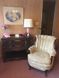 Antique chair, beautiful cabinet, pink phone!