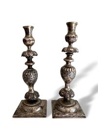 Pair of vintage hollow silver candlesticks. Measures 11 ¾” and 12” respectively. In good condition with aged patina finish.  