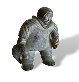 Vintage Inuit Sculpture – 7” tall x 6 ½” wide.  Damage to one hand, a few shallow small chips to body. 
