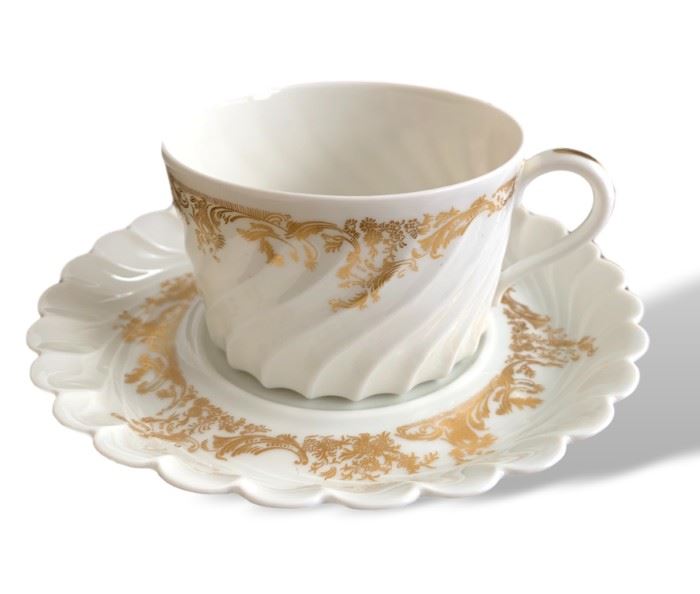 Beautiful Haviland Limoge LADORE gold and white porcelain set.  Light wear. No chips. Includes 13 coffee cups, 12 saucers, 1 gravy boat, 1 oval platter, 1 oval bowl. 
