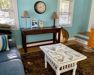 Extensively carved table and detailed spindle legged table. Can be used as a coffee or end table. Inside or out!