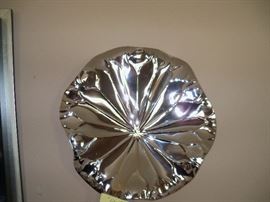 Lily pad?  can be hung or used as a plate/bowl