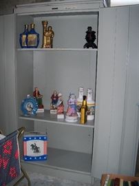 metal cabinet and collectible liquor bottles