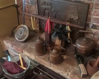 Antique copper pitchers, wood candleholder, brass bed warmer, antique knife box, wooden mortar and pestle, primitive iron candle holder