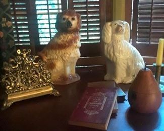 Staffordshire dogs, brass letter holder, books, pear-shaped tea caddy, candlestick