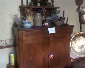 Beautiful double-door cabinet with wood pulls, high attached shelf on back; toleware; crockery; candles, silverware, and more