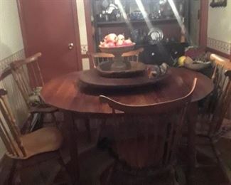 Round dining table, lazy Susan center, Windsor chairs