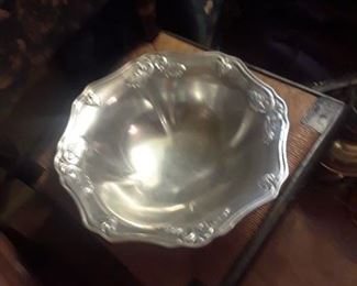 Contemporary metal bowl with scalloped and flaring top