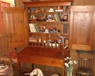 Plantation desk with doors open, Windsor chair at left