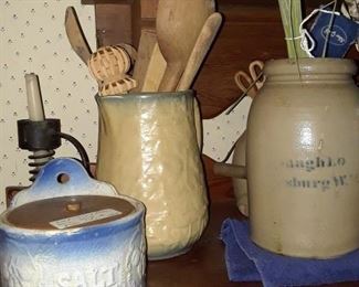 Stoneware crockery; wrought iron candleholders; wooden utensils