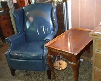 Leather upholstered wing chair and tea table