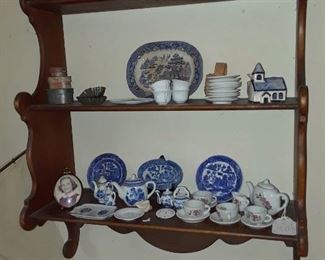 Wall shelf with children's teasets