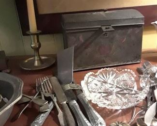 Strainers, candlesticks, flatware